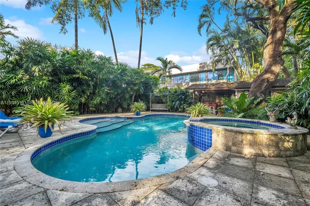 a view of a swimming pool with a patio