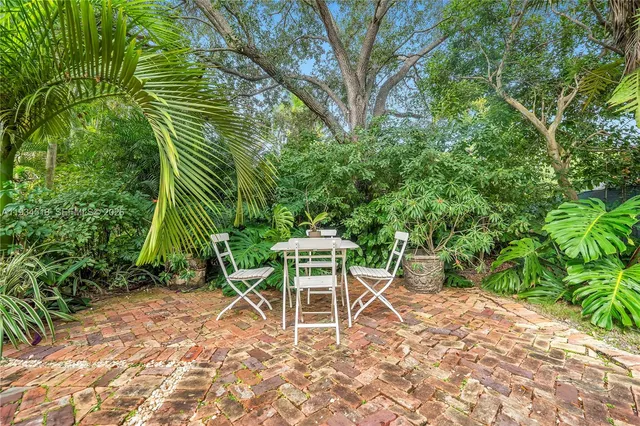 a chair and table in the garden