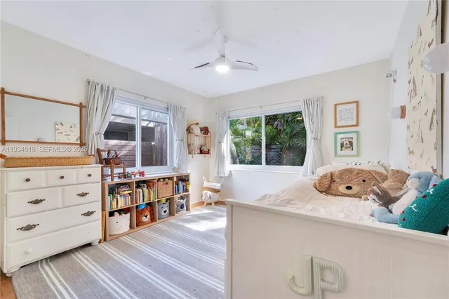 a bed room with a bed and a window