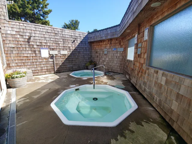 a backyard of a house with outdoor seating
