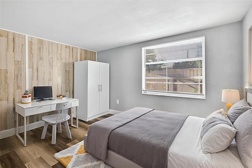 7835 Birchwood Drive Port Richey, FL 34668 - Photo 13 of 14 a bedroom with a bed and a window