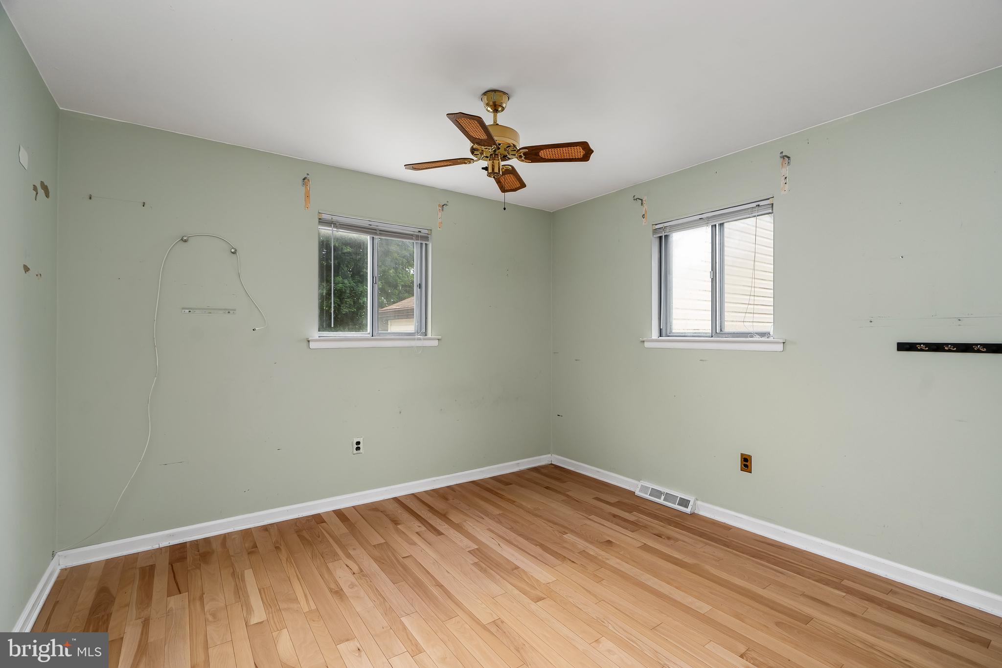 2 St Pats Circle Elkton, MD 21921 - Photo 6 of 22 a view of empty room with wooden floor and fan