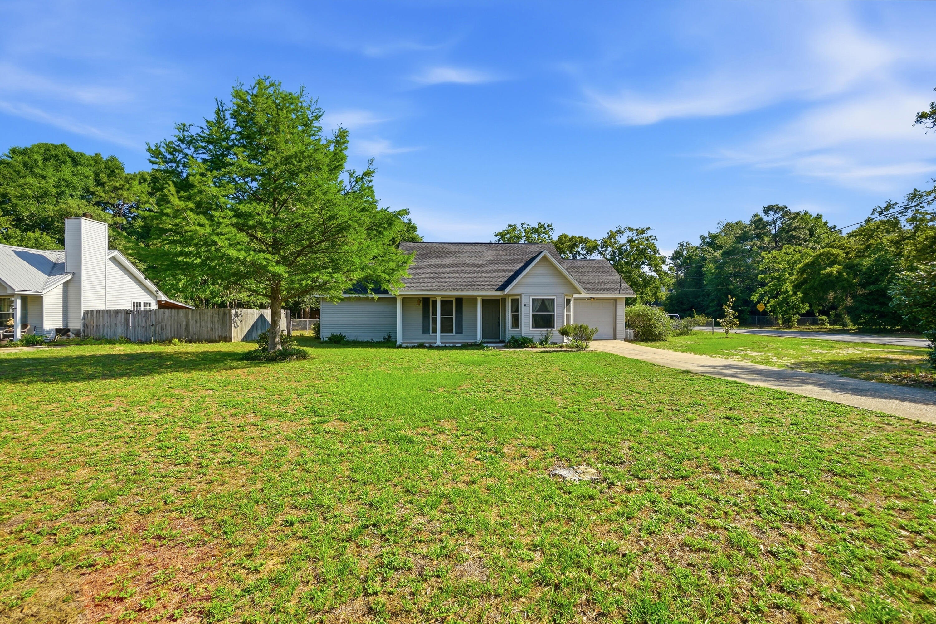 324 John King Road Crestview, FL 32539 - Photo 1 of 28 a front view of a house with a yard
