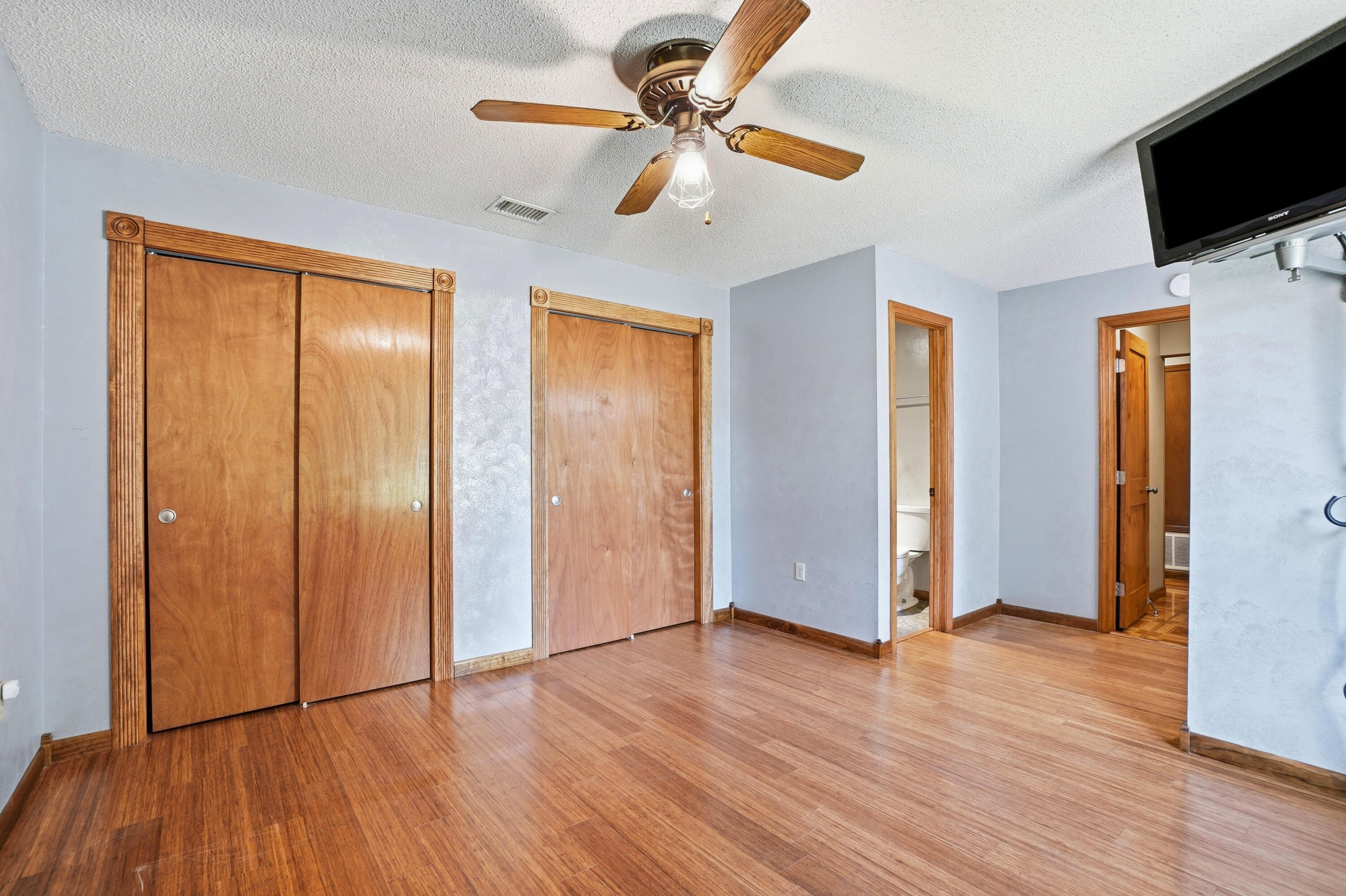 324 John King Road Crestview, FL 32539 - Photo 12 of 28 a view of an empty room with window and wooden floor