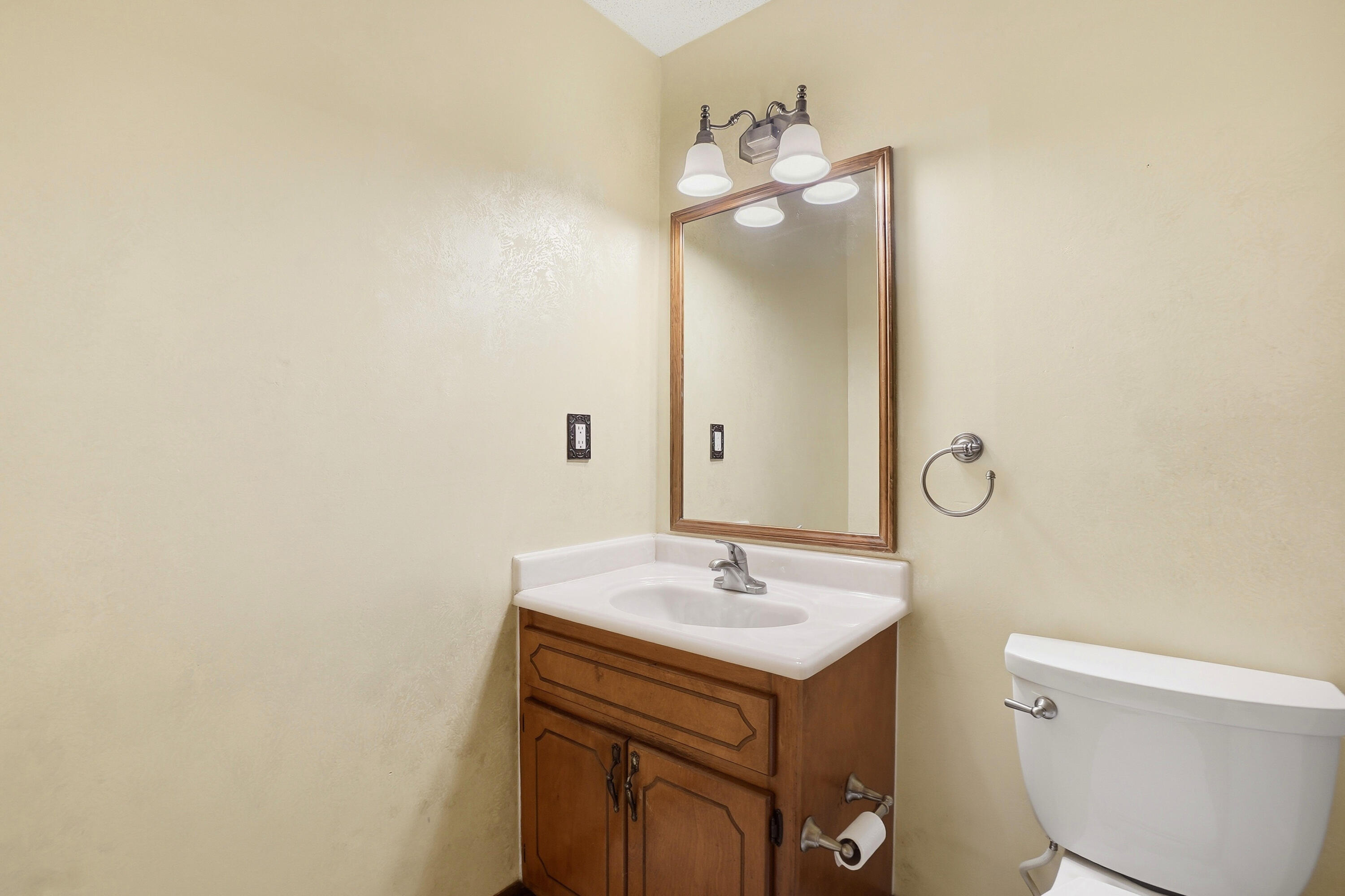 324 John King Road Crestview, FL 32539 - Photo 22 of 28 a bathroom with a sink mirror vanity and toilet