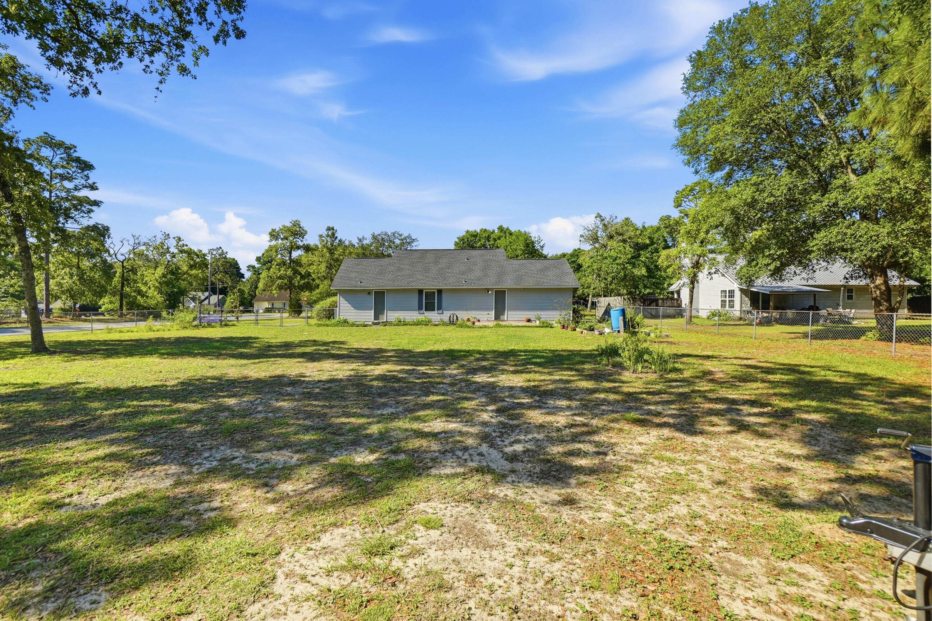 324 John King Road Crestview, FL 32539 - Photo 25 of 28 a house view with a swimming pool