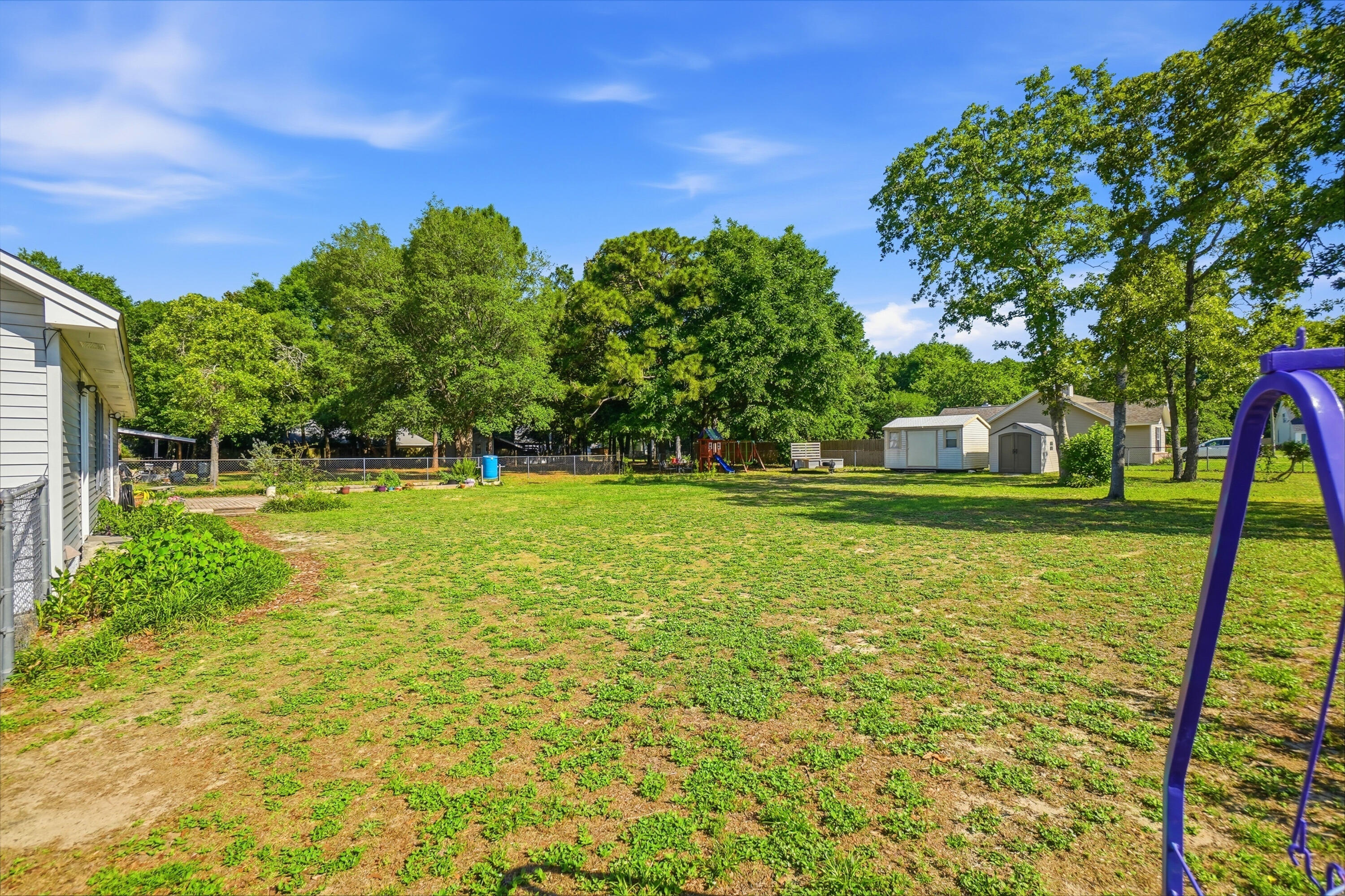 324 John King Road Crestview, FL 32539 - Photo 27 of 28 a backyard of a house with lots of green space