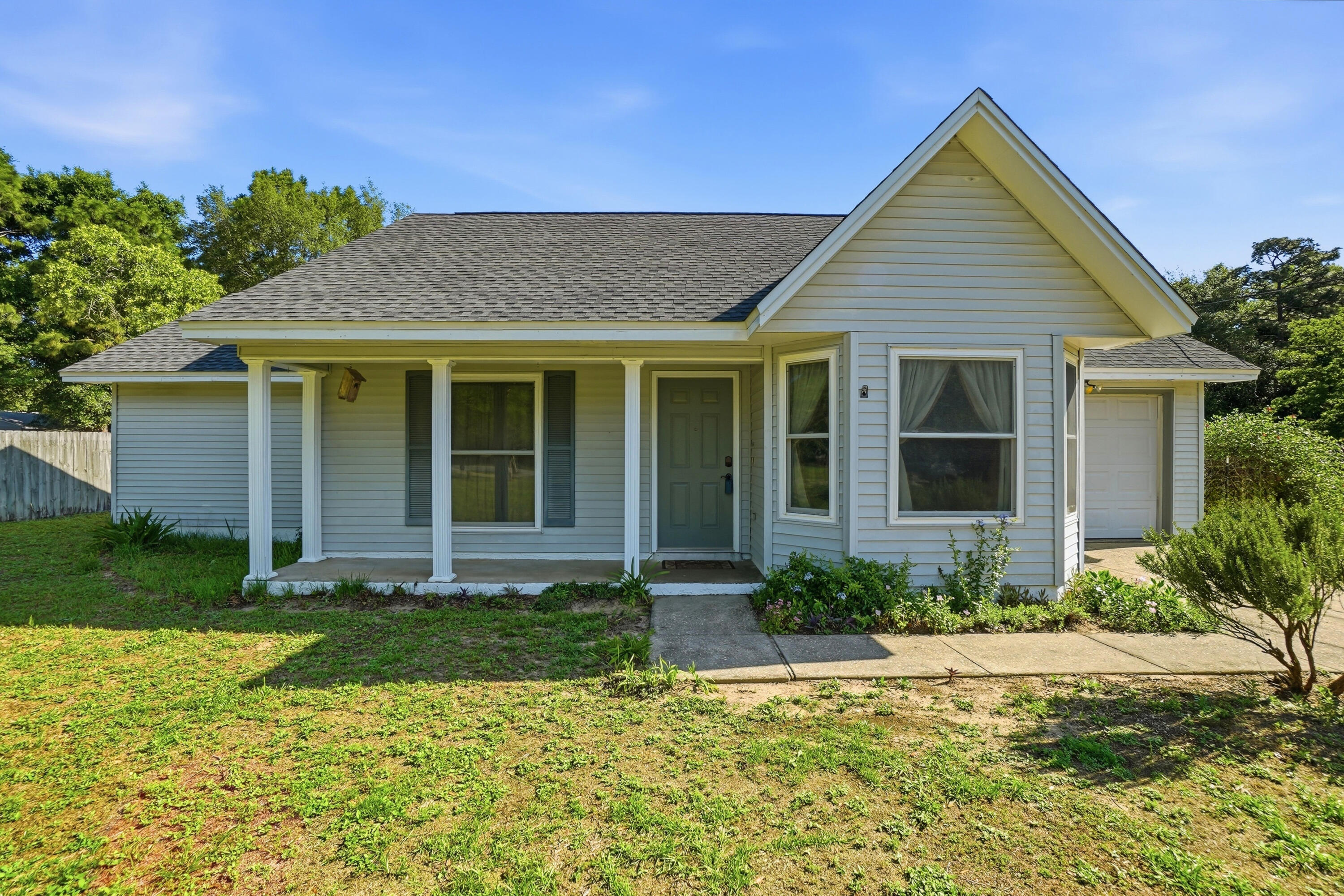 324 John King Road Crestview, FL 32539 - Photo 3 of 28 front view of a house and a yard