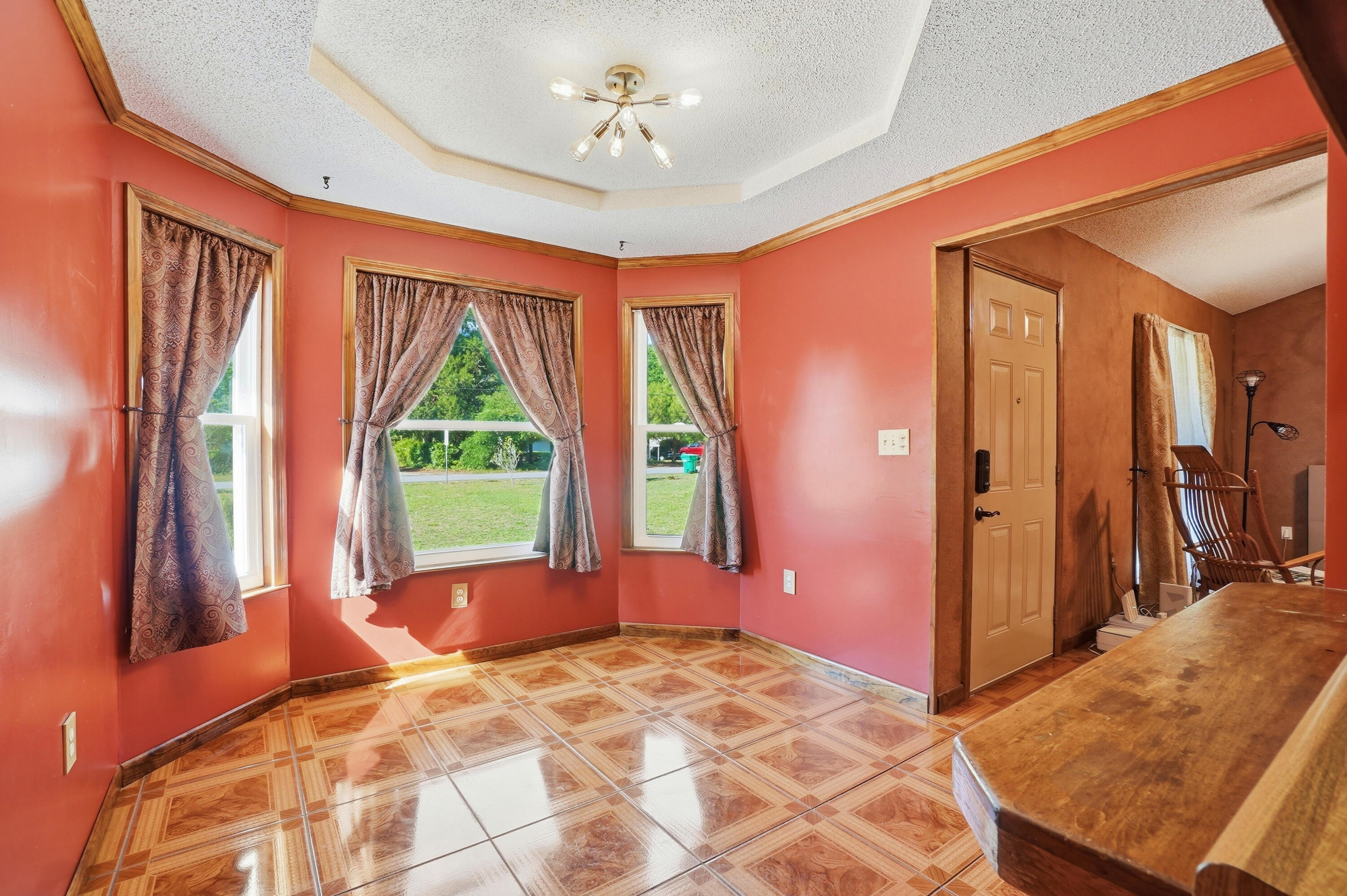 324 John King Road Crestview, FL 32539 - Photo 8 of 28 a bedroom with a bed and a large window