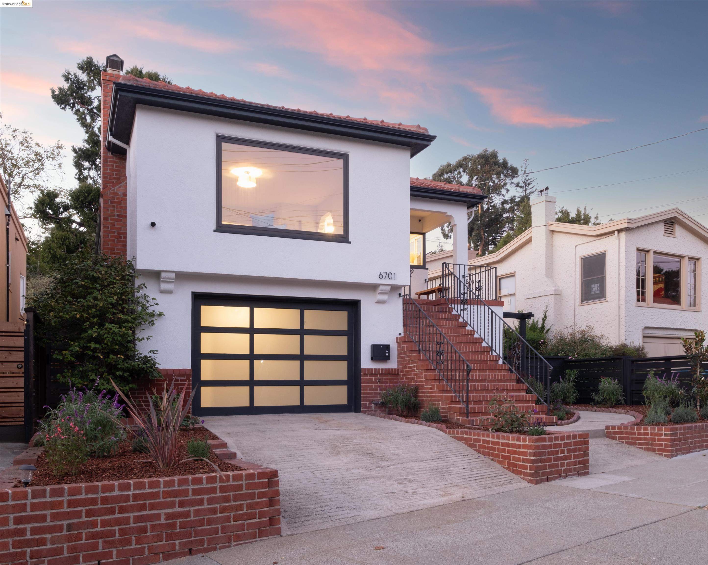 a front view of a house with garden