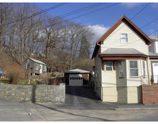 a view of a large house with a street