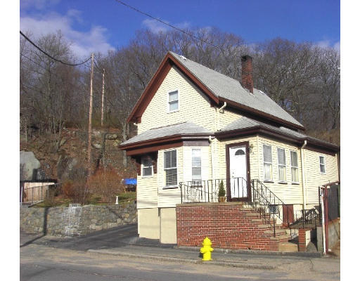 23 Warner Street Gloucester, MA 01930 - Photo 2 of 13 a front view of a house with a yard