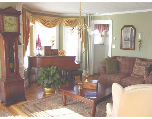 23 Warner Street Gloucester, MA 01930 - Photo 3 of 13 a living room with furniture and a large window