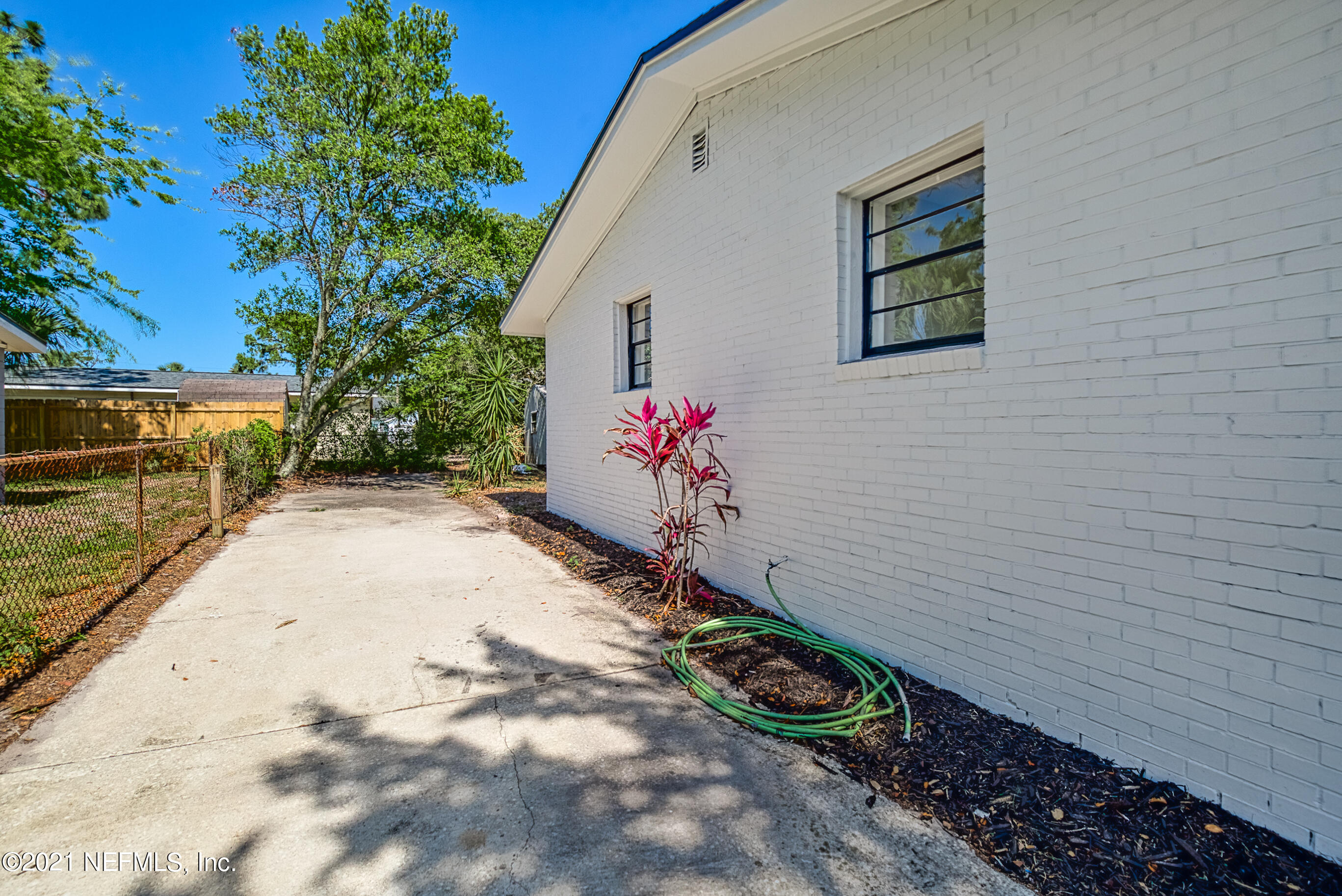 447 Irex Road Atlantic Beach, FL 32233 - Photo 33 of 35 a view of a entryway with flower plants