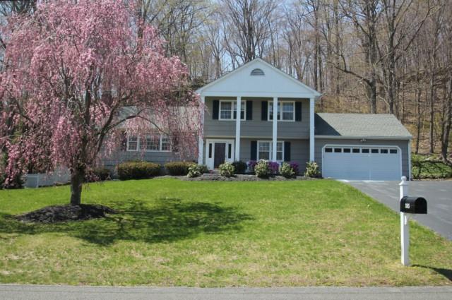 385 Mountain Laurel Road Fairfield, CT 06824 - Photo 1 of 1 a front view of a house with a yard