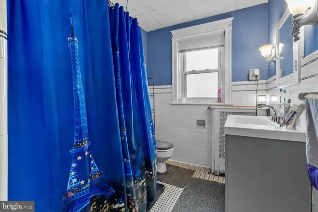 a room with a mirror and a window