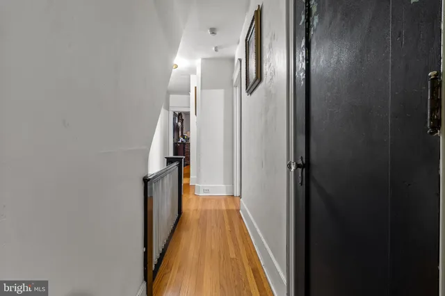 a view of gallery with wooden floor