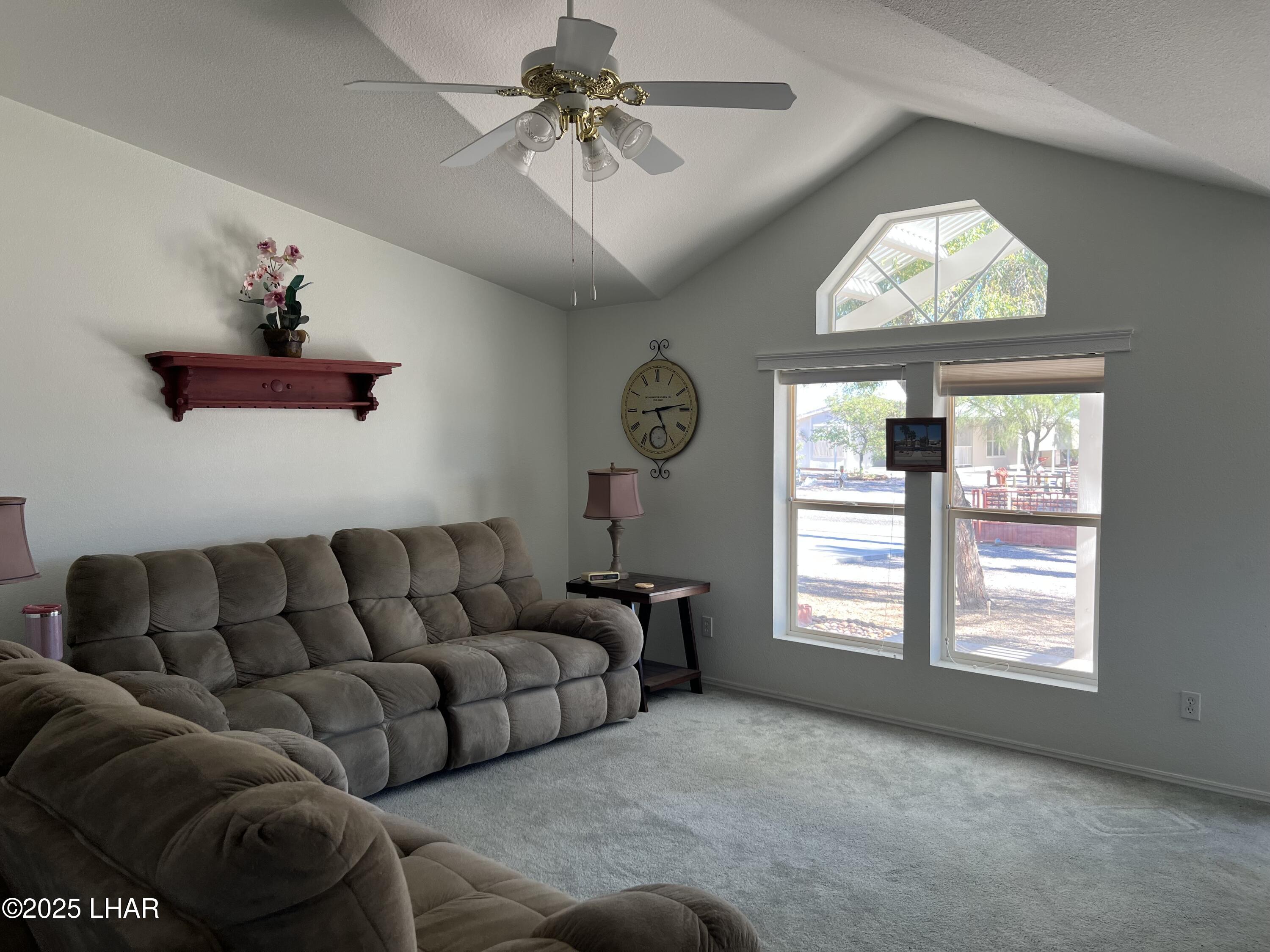 49688 Ruby Avenue Quartzsite, AZ 85346 - Photo 13 of 33 Living room with vaulted ceilings and ceiling fan for added comfort
