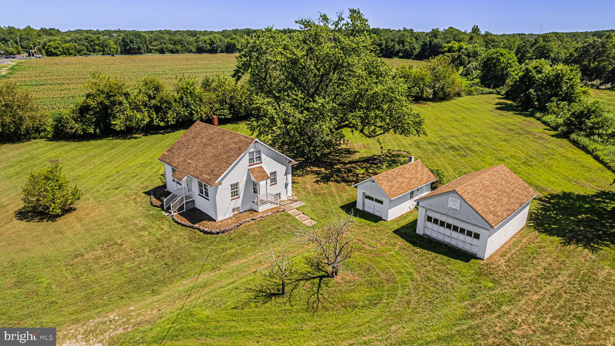 an aerial view of a house with pool lake view and mountain view