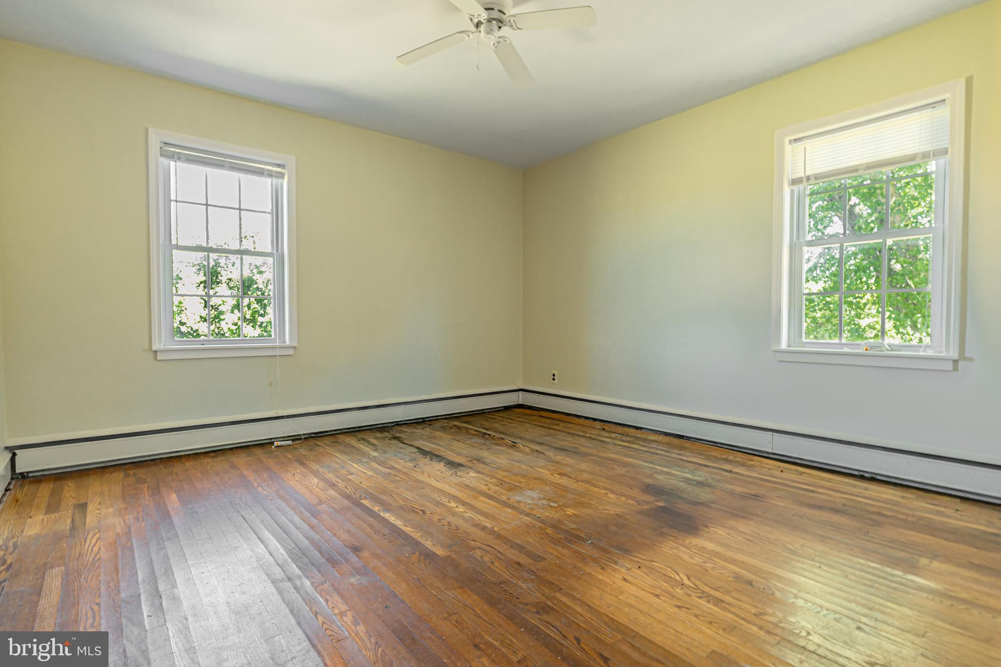 16 East Factory Road Berlin, NJ 08009 - Photo 3 of 13 a view of an empty room with wooden floor and a window
