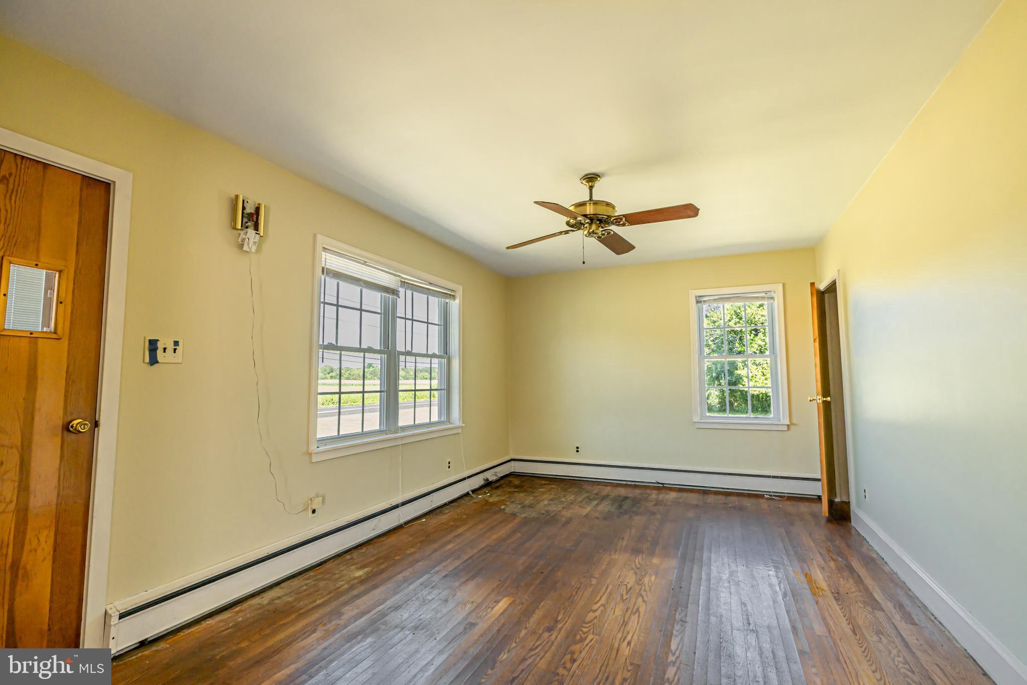 16 East Factory Road Berlin, NJ 08009 - Photo 5 of 13 a view of empty room with wooden floor and fan