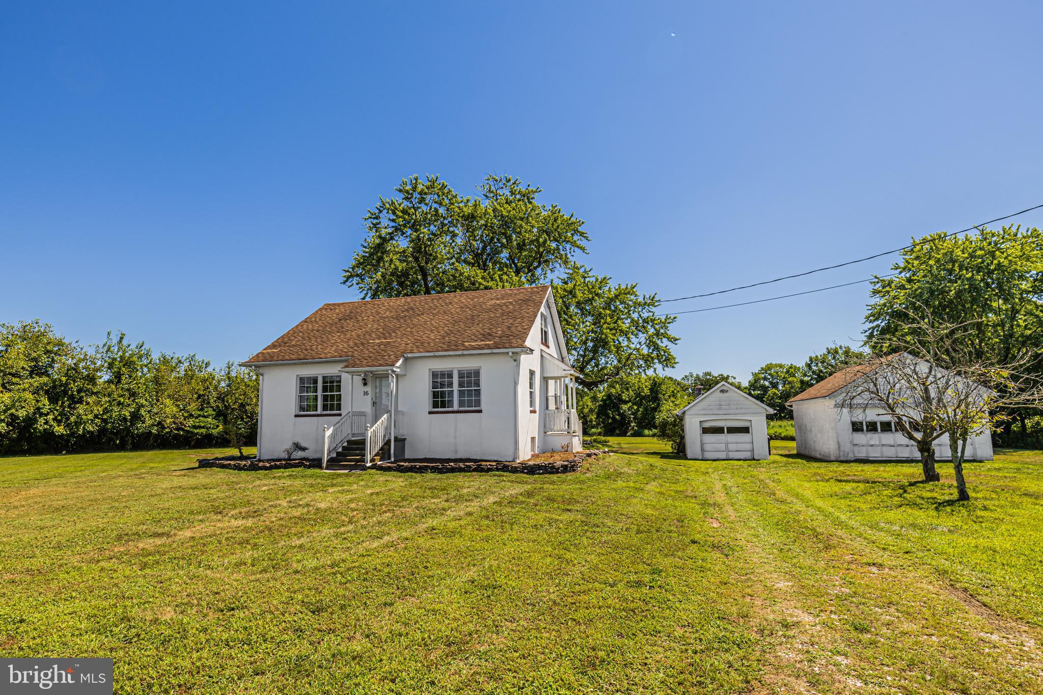 16 East Factory Road Berlin, NJ 08009 - Photo 9 of 13 a view of house with garden and tall trees