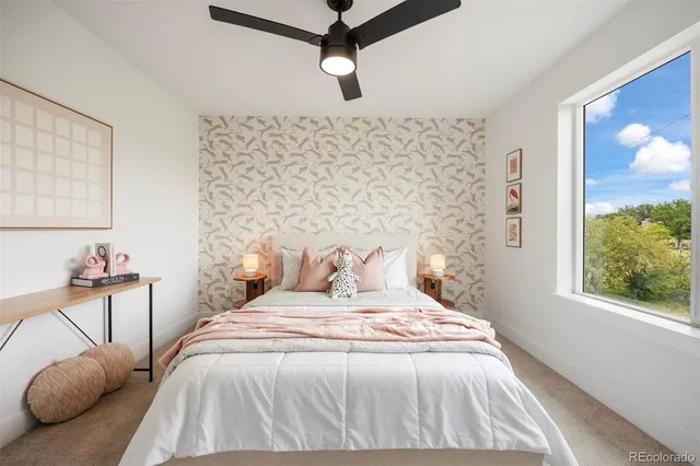 a bedroom with a bed and a chandelier