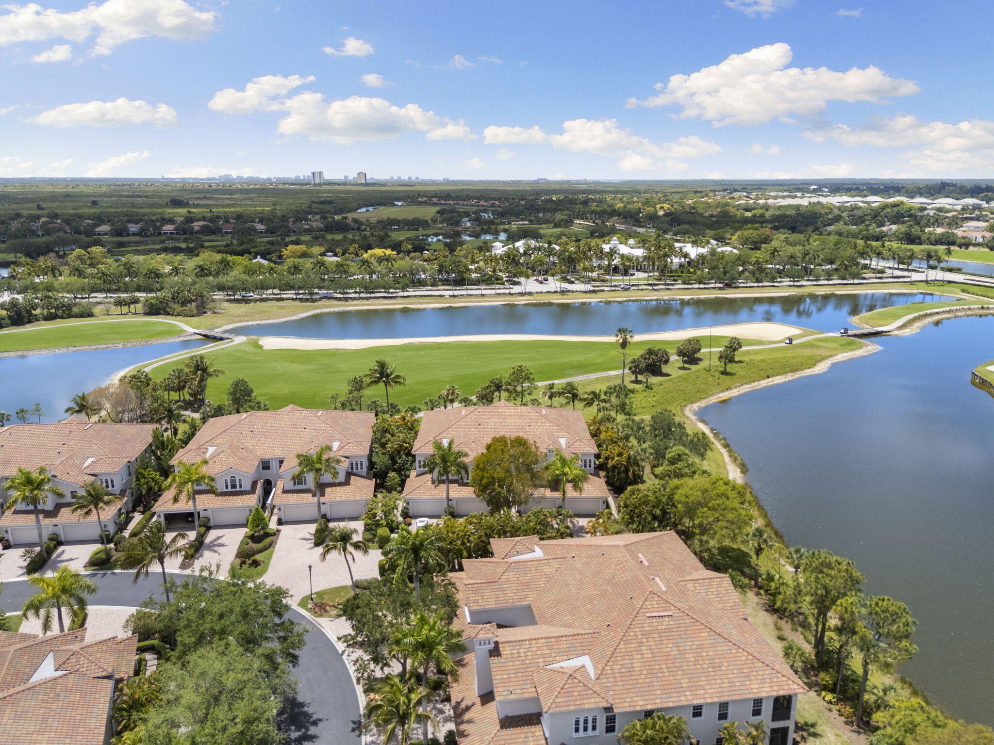 9066 Cascada Way, Unit 101 Naples, FL 34114 - Photo 31 of 51 an aerial view of ocean and residential houses with outdoor space