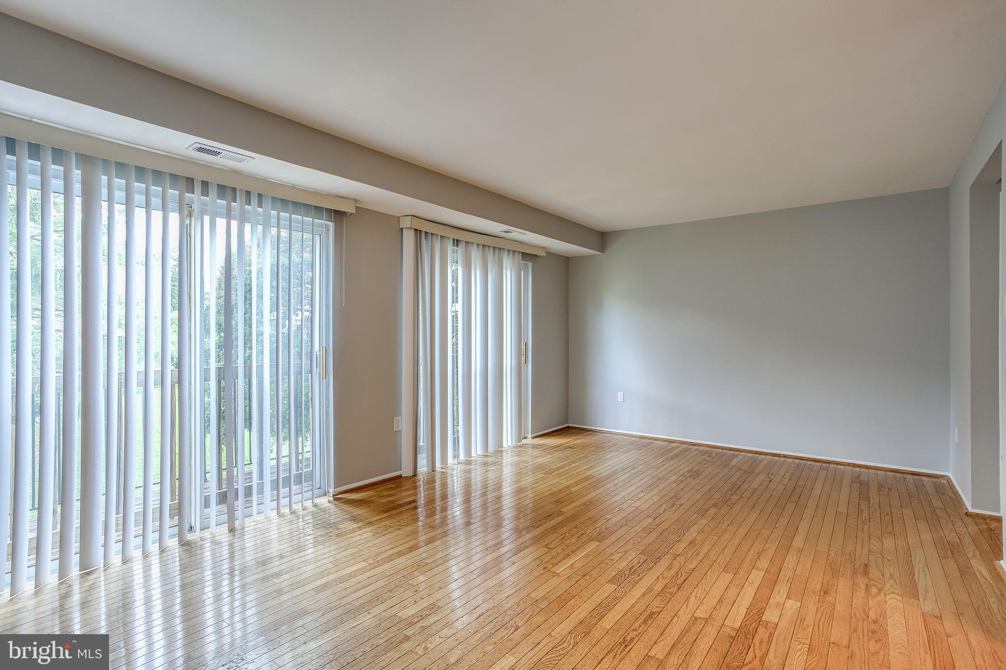 2356 Sun Valley Circle, Unit 2F Silver Spring, MD 20906 - Photo 9 of 31 living room with sliding doors to balcony