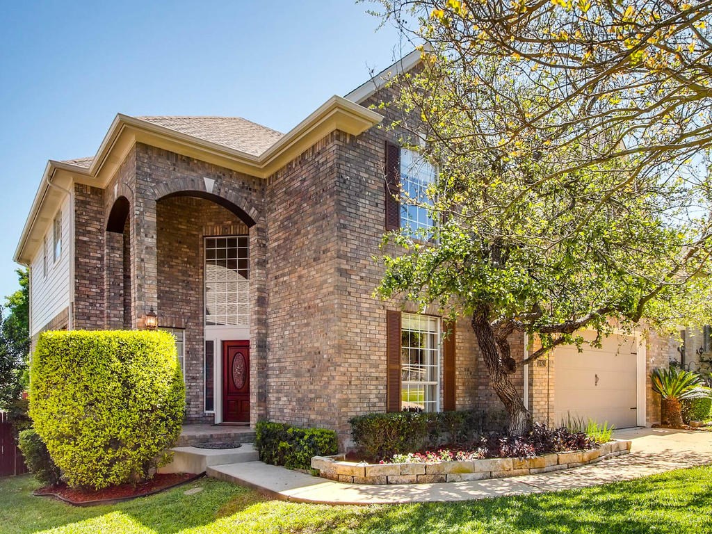 10628 Chestnut Ridge Road Austin, TX 78726 - Photo 1 of 1 Standard Pacific Country French Brick home with shutters on outside windows and lots of curb appeal!
