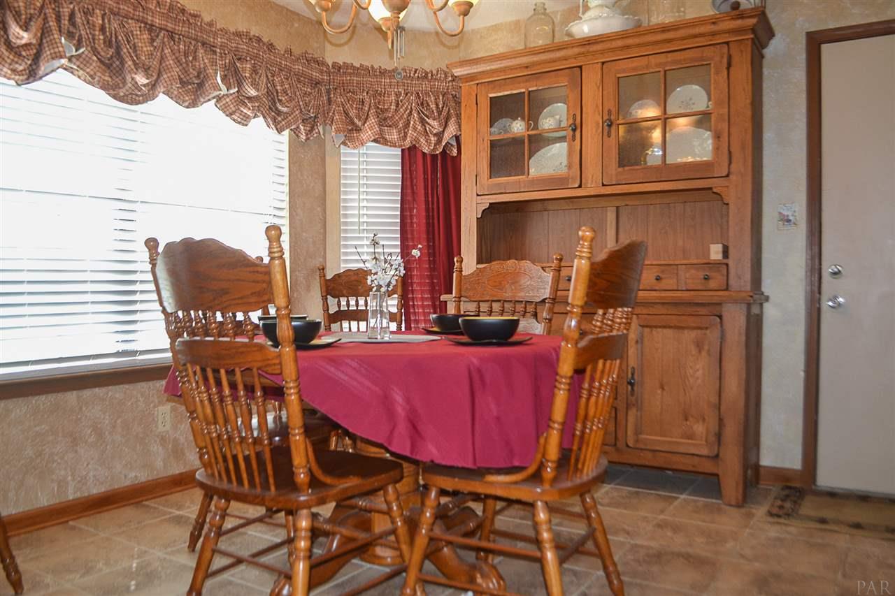 2160 Jacks Branch Road Cantonment, FL 32533 - Photo 8 of 17 Large breakfast nook with faux painted walls!