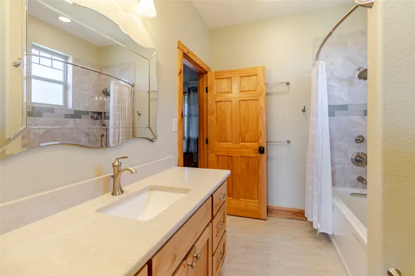 a bathroom with a sink and a mirror