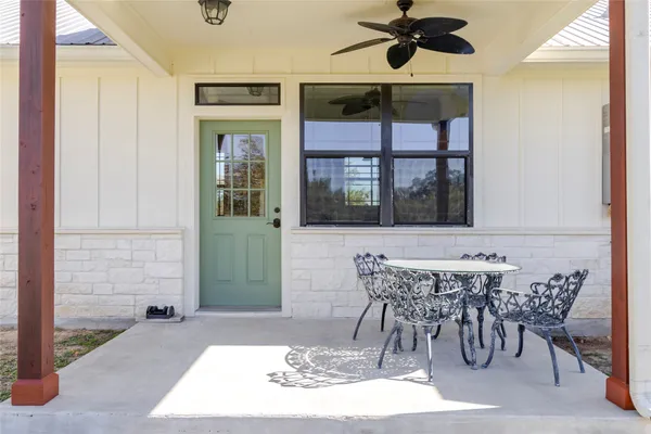 a view of a dining room with furniture and window