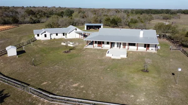 a view of a big house with a big yard