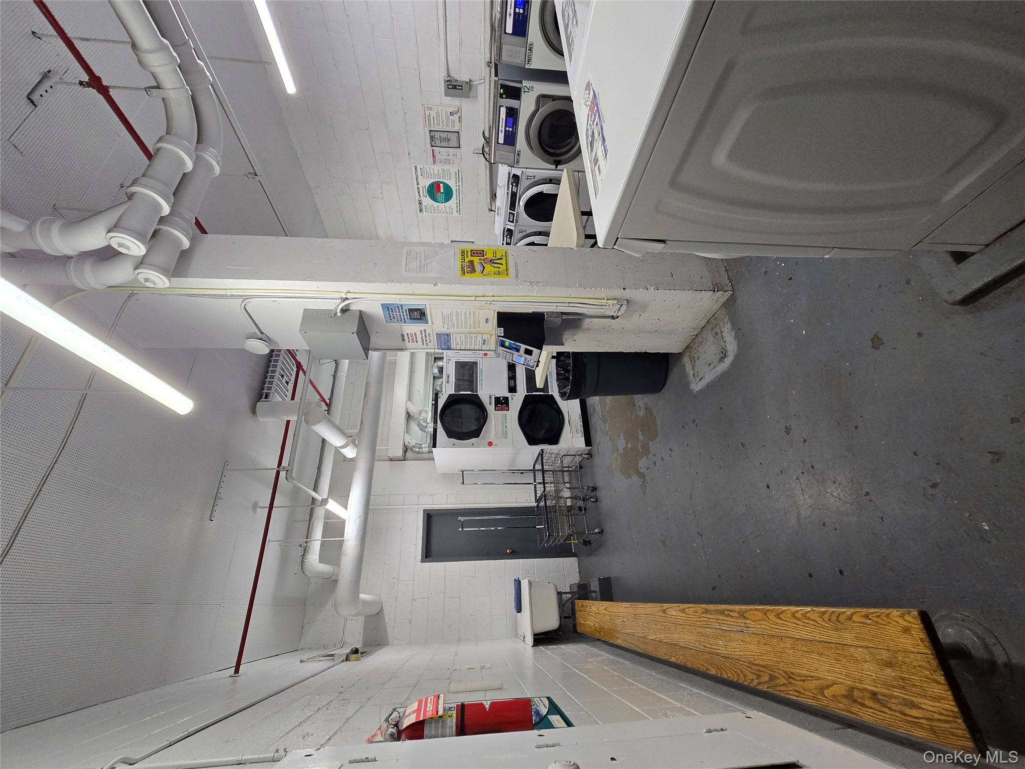 34-12 113th Street, Unit 8G Queens, NY 11368 - Photo 12 of 13 a kitchen with refrigerator and stove top oven