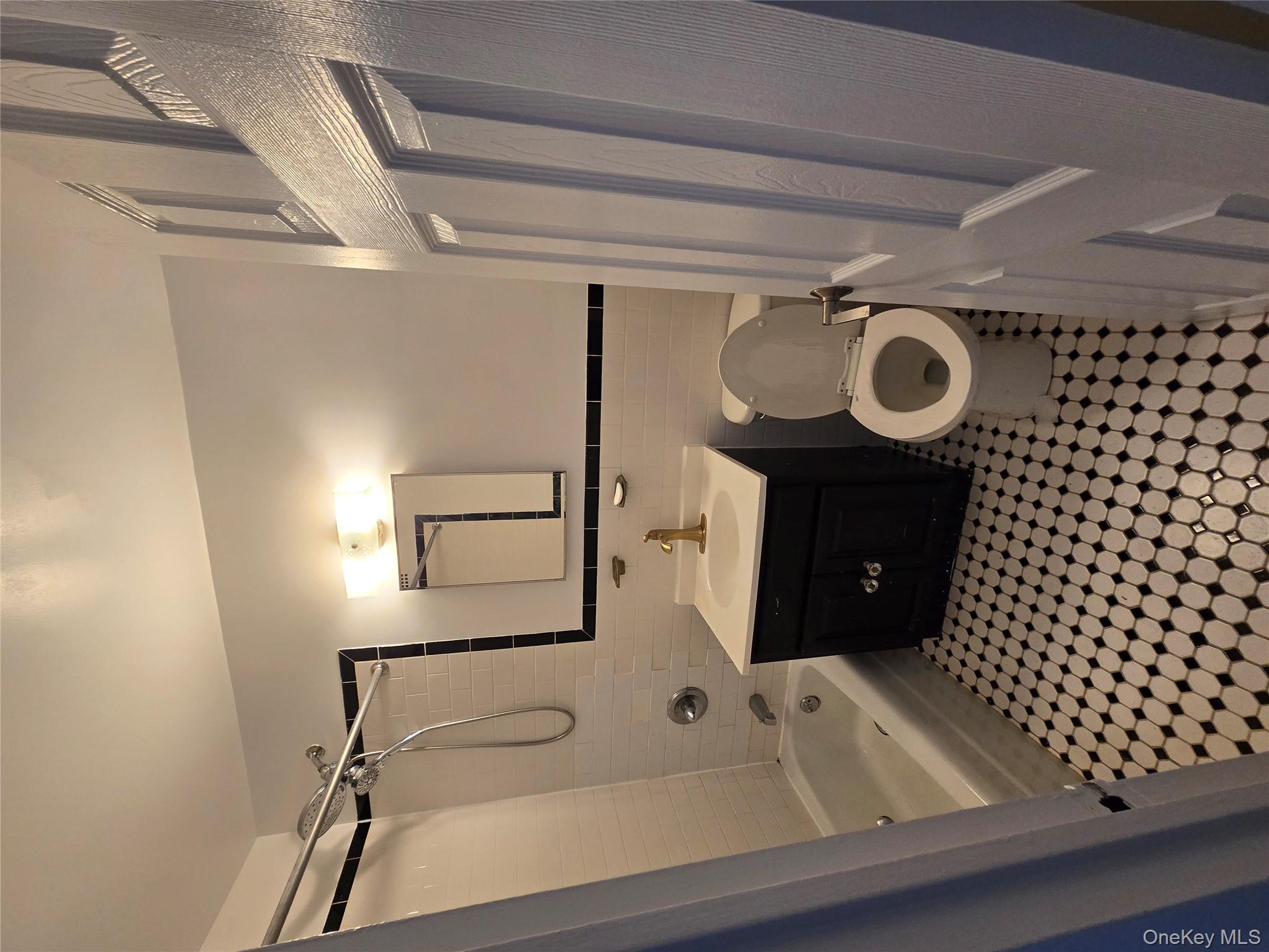 34-12 113th Street, Unit 8G Queens, NY 11368 - Photo 3 of 13 a bathroom with a sink toilet and shower