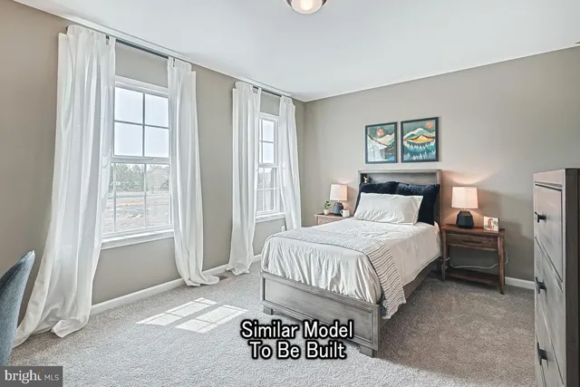 a bedroom with a bed and a chair