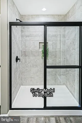 a view of a bedroom with a bed and cabinets