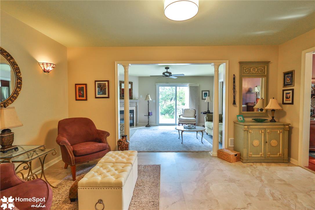 4191 Walter Road Bethlehem, PA 18020 - Photo 5 of 23 Welcoming living area with pristine tile flooring and elegant archways leading to another inviting space.