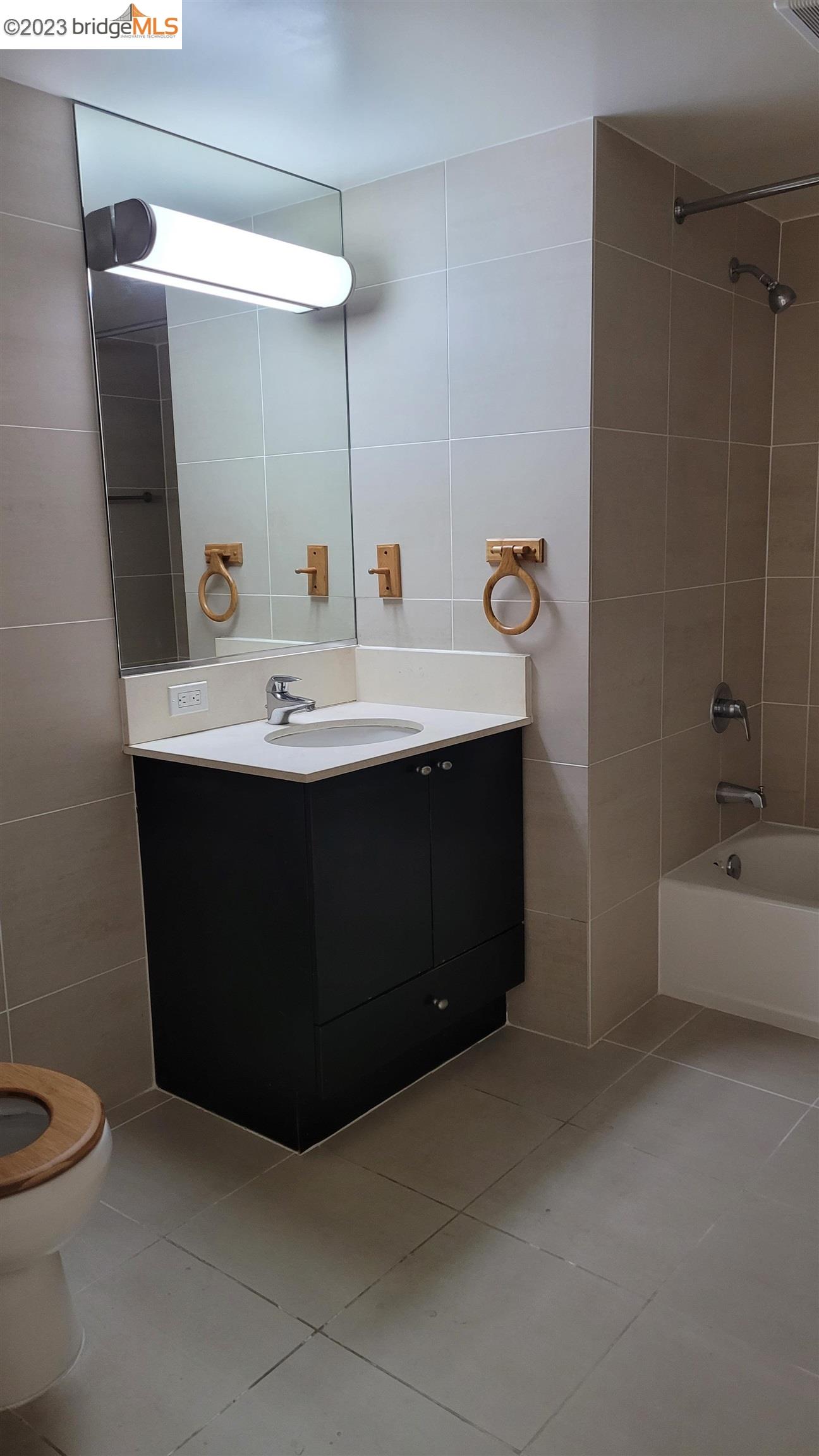 311 Oak Street, Unit PH27 Oakland, CA 94607 - Photo 12 of 21 a bathroom with a sink and a mirror