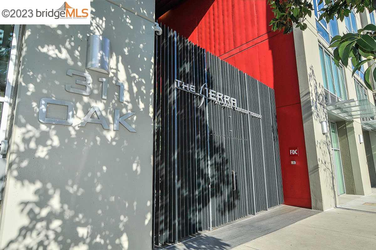 311 Oak Street, Unit PH27 Oakland, CA 94607 - Photo 19 of 21 a view of a palm tree in front of a building