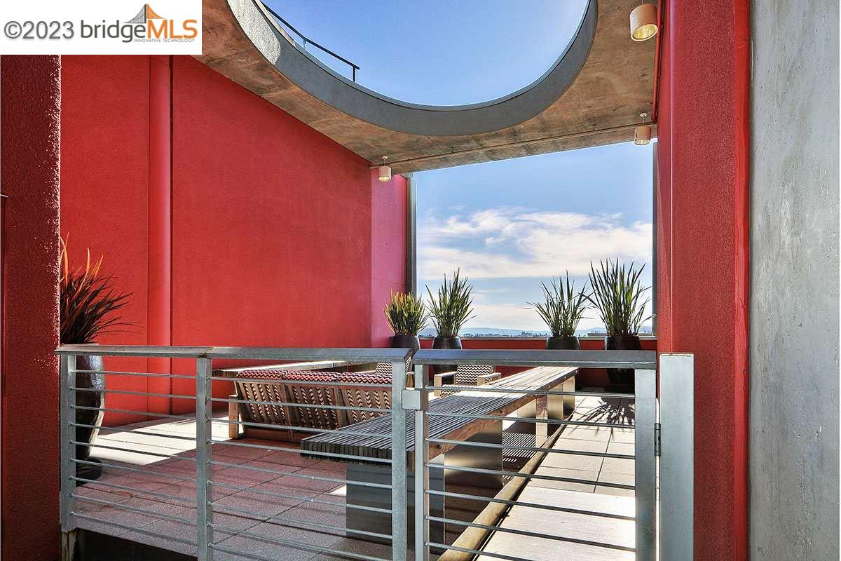 311 Oak Street, Unit PH27 Oakland, CA 94607 - Photo 2 of 21 a view of balcony with wooden floor and a potted plant