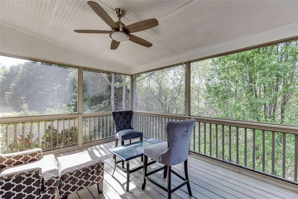 4880 Stone Moss Path Hoschton, GA 30548 - Photo 38 of 66 a view of a balcony with furniture