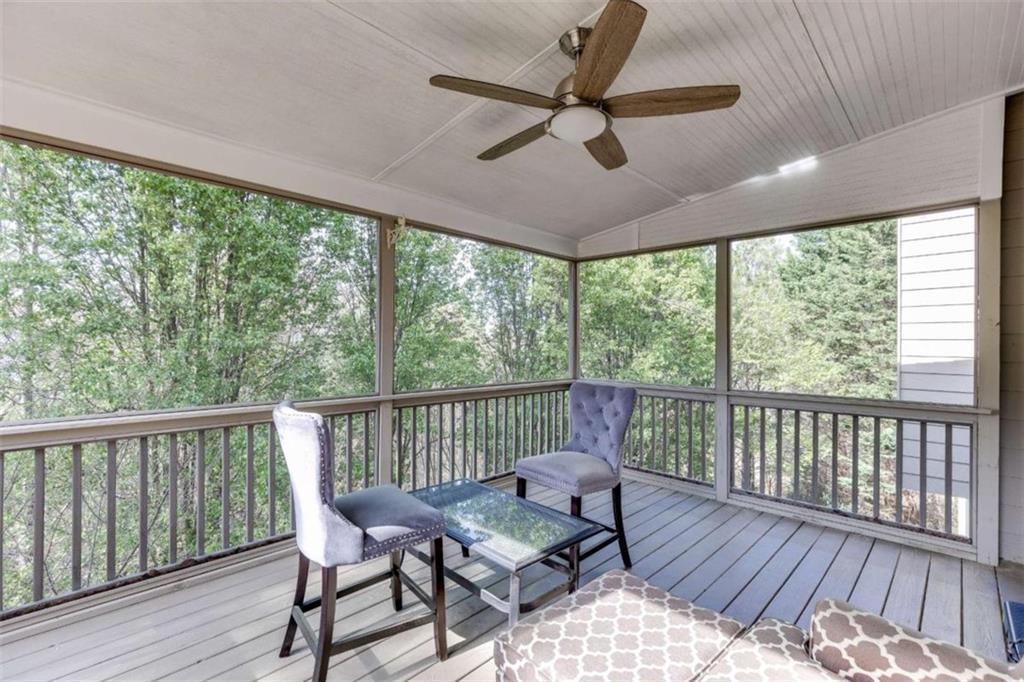 4880 Stone Moss Path Hoschton, GA 30548 - Photo 39 of 66 a view of a balcony with furniture