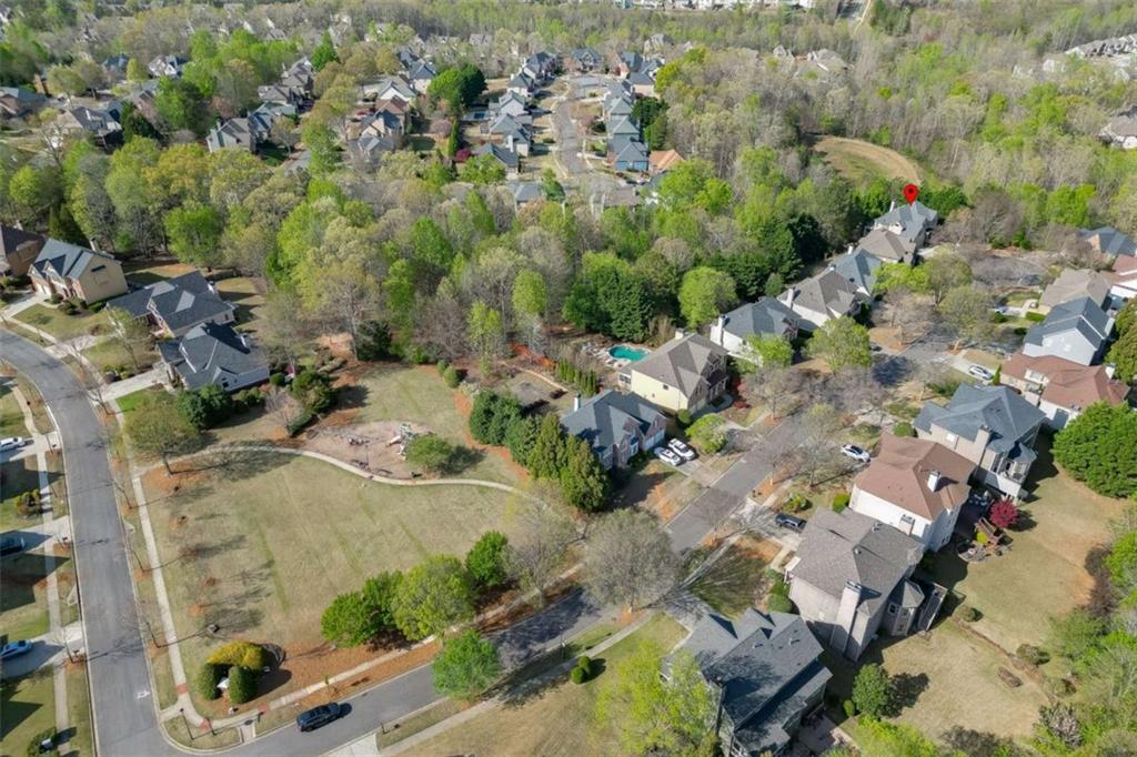4880 Stone Moss Path Hoschton, GA 30548 - Photo 54 of 66 an aerial view of residential house with outdoor space