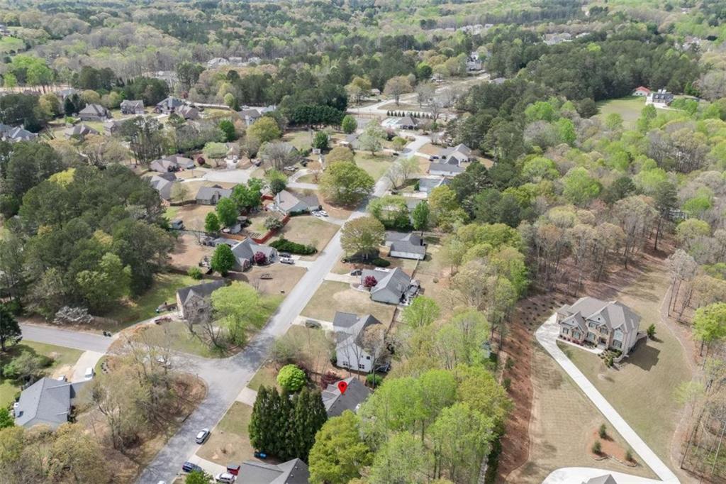 4880 Stone Moss Path Hoschton, GA 30548 - Photo 55 of 66 an aerial view of residential houses with outdoor space