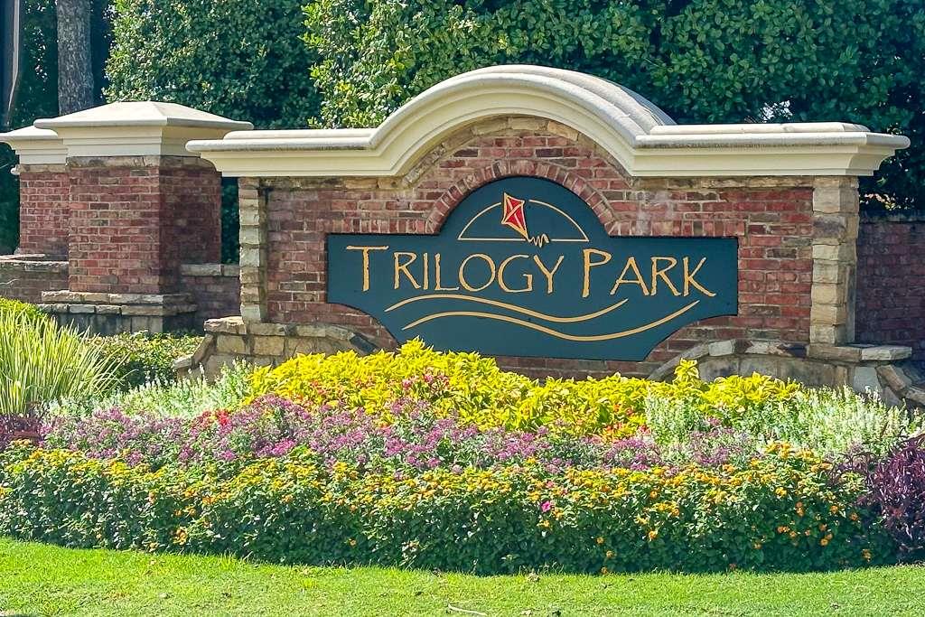 4880 Stone Moss Path Hoschton, GA 30548 - Photo 61 of 66 a sign that is on the side of a building