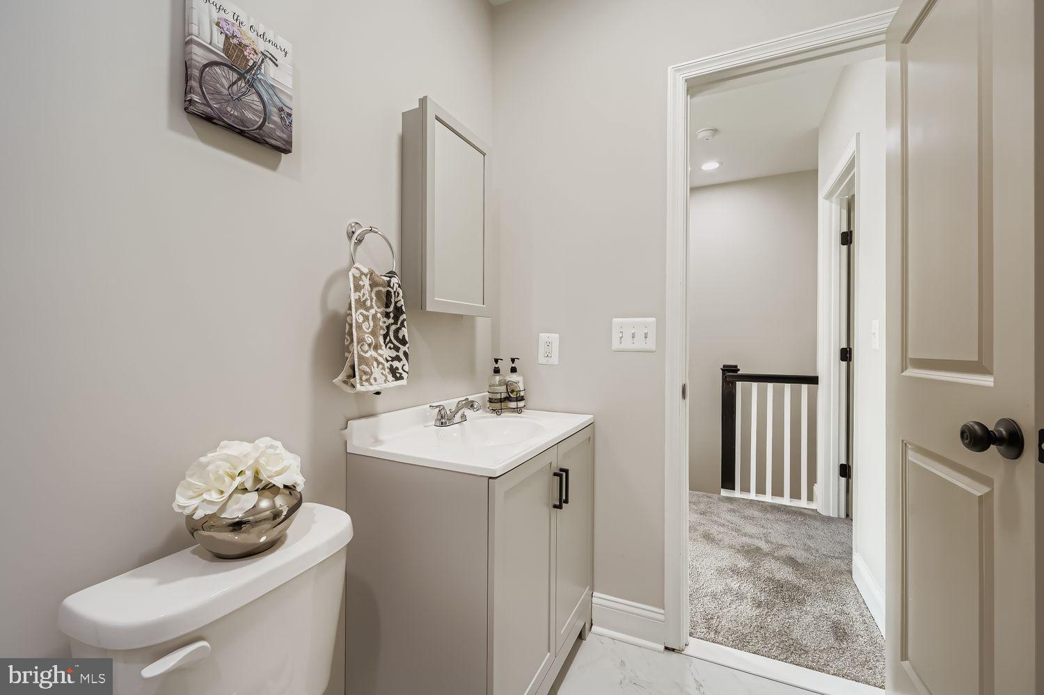 4119 Fairview Avenue Baltimore, MD 21216 - Photo 16 of 25 a bathroom with a sink toilet and shower