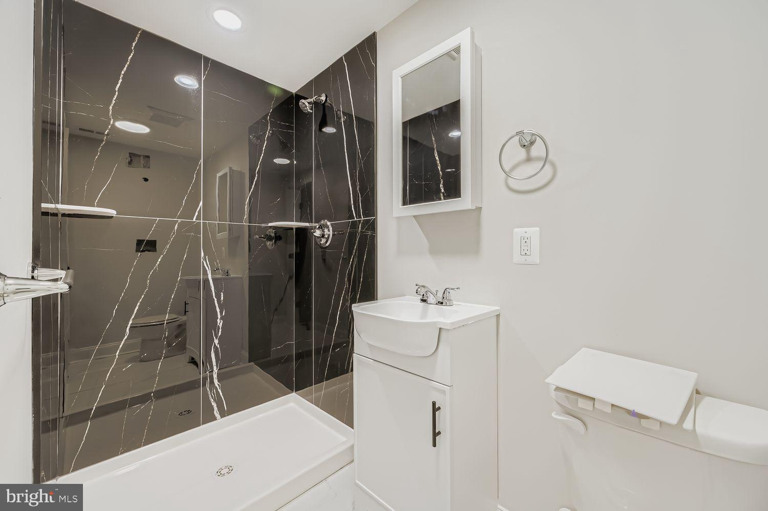 4119 Fairview Avenue Baltimore, MD 21216 - Photo 20 of 25 a bathroom with a shower and a sink