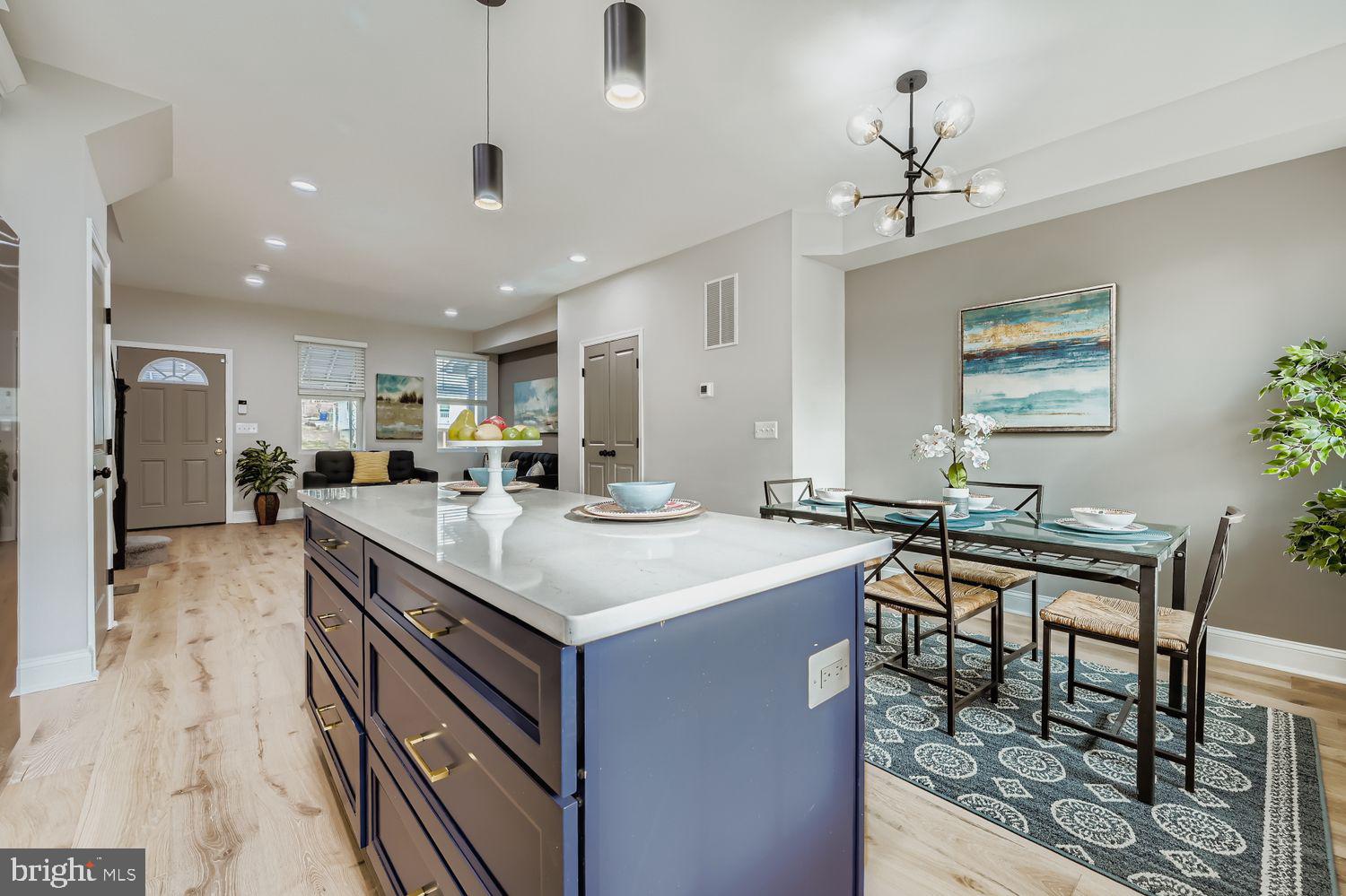4119 Fairview Avenue Baltimore, MD 21216 - Photo 9 of 25 a kitchen with granite countertop a sink a counter top space appliances and cabinets
